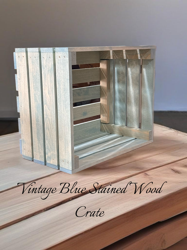 Rustic farmhouse vintage blue stained wooden crate with text overlay on wood table.