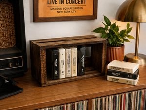 Early American wooden 8 track tape storage crate displayed on a record cabinet with vintage 8 track tapes