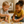 Two smiling children building with natural wooden toy blocks