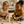 Kids laughing while building with natural wooden toy blocks