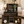 Set of 4 Dark Walnut wooden nesting crates styled with candles, plants, books, and farmhouse decor in a living room