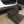 Wooden 2-step stool in dark walnut finish placed beside a car door for easy entry.