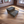 Rustic 2-step stool in dark walnut stain, styled in a living room with Darla’s Studio 66 logo