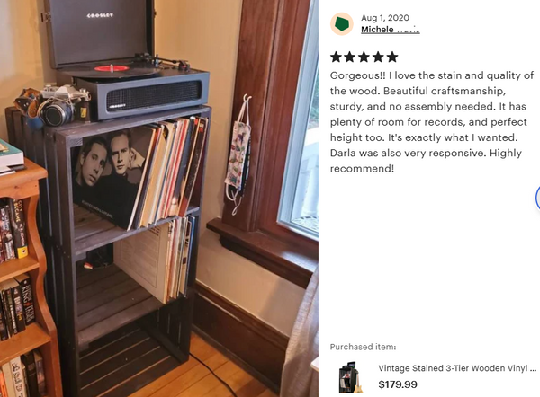 Customer photo of 3-tier dark stained wooden record stand with LPs and turntable.