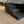 Angled view of rustic 4-step wooden pet stairs on carpet