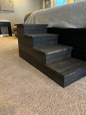 Angled view of rustic 4-step wooden pet stairs on carpet