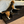 Beagle climbing 4-step wooden pet stairs to reach a tall bed