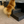 Small fluffy dog using rustic 4-step wooden stairs to climb onto bed