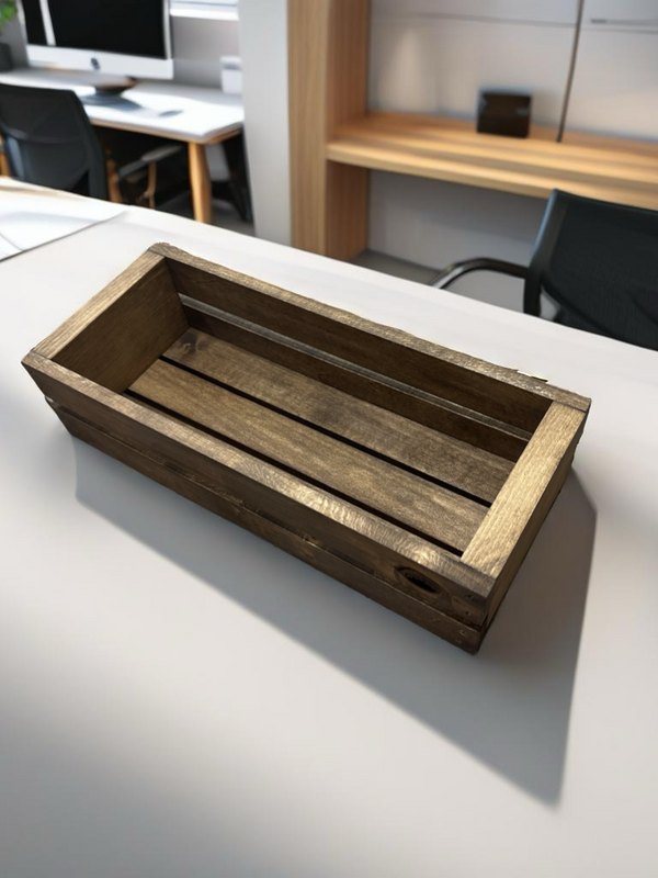 Wooden cassette storage box placed on a white work desk.
