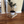 Wooden pallet used as a plant stand holding a potted plant