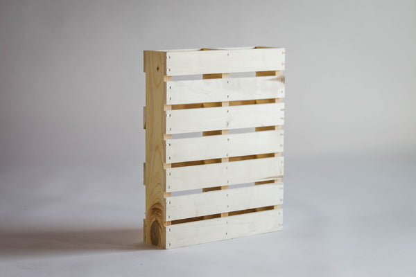 Rustic pallet plant stand with modern styling, staged indoors