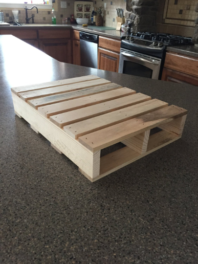 Rustic wooden pallet displayed on a kitchen counter