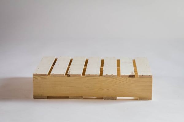 Small rustic pallet displayed on white background