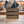 Rustic wood utensil holder crate filled with utensils on display