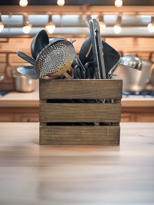 Rustic wood utensil holder crate filled with utensils on display