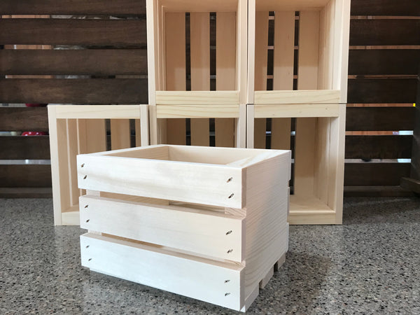 Set of six small unfinished wooden crates shown in a simple front-facing arrangement.