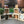 Wooden crates with rustic seed packets, plants, and decor arranged for farmhouse display.