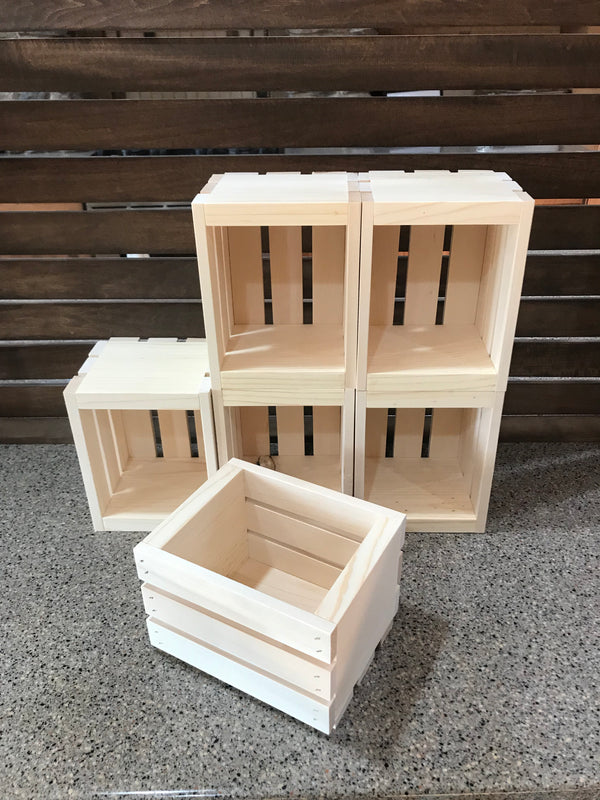 Close-up of a single small natural wooden crate, unfinished rustic design.