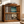 Wooden turntable stand with vinyl record storage in Early American stain holding a record player and vinyl albums in a living room