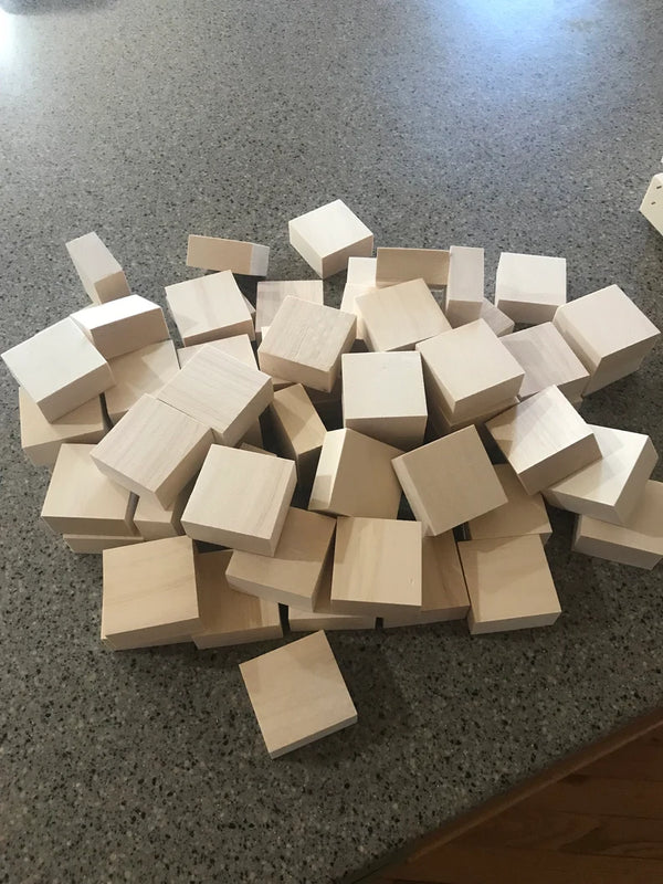 Pile of natural wooden toy blocks spread on a countertop