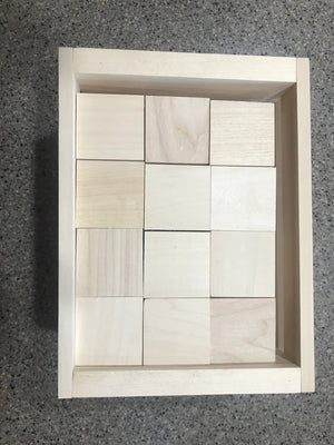 Natural wooden blocks neatly stored inside a wooden crate