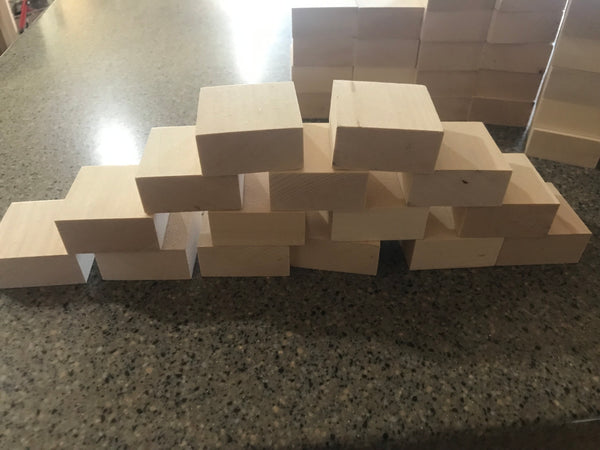 Wooden toy blocks stacked in a pyramid shape on a counter