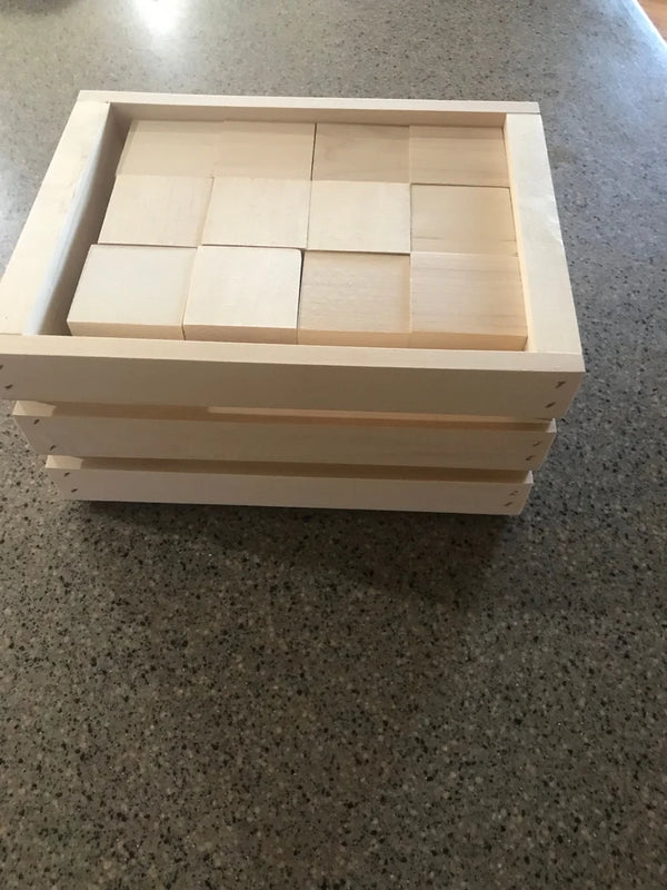 Top view of 60 natural wooden blocks arranged in crate