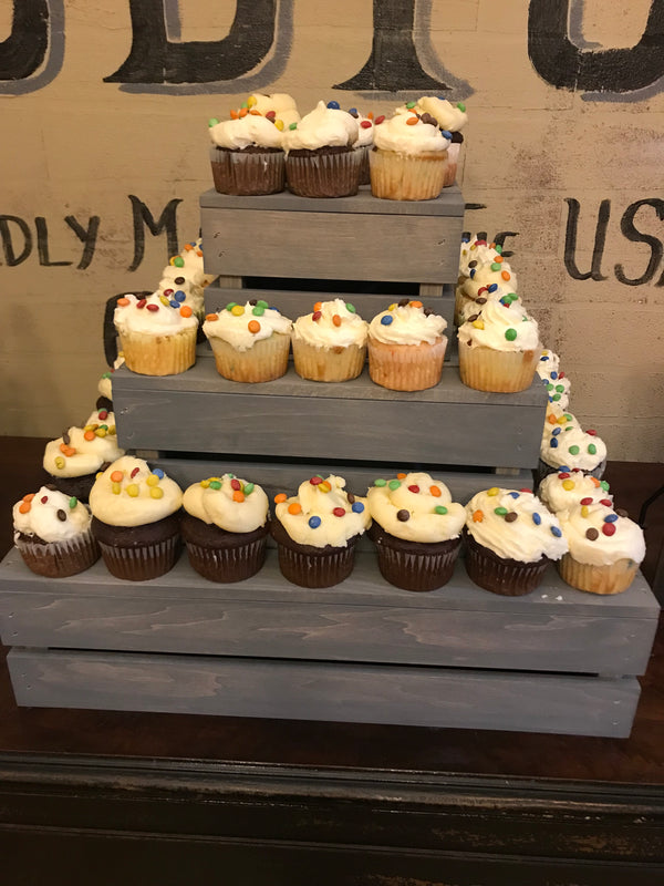 Cupcake stand in antique gray finish shown on a dessert table with Mr. & Mrs. wedding sign.