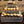 Close-up detail of cupcakes displayed on an antique gray 3-tier wooden cupcake stand.