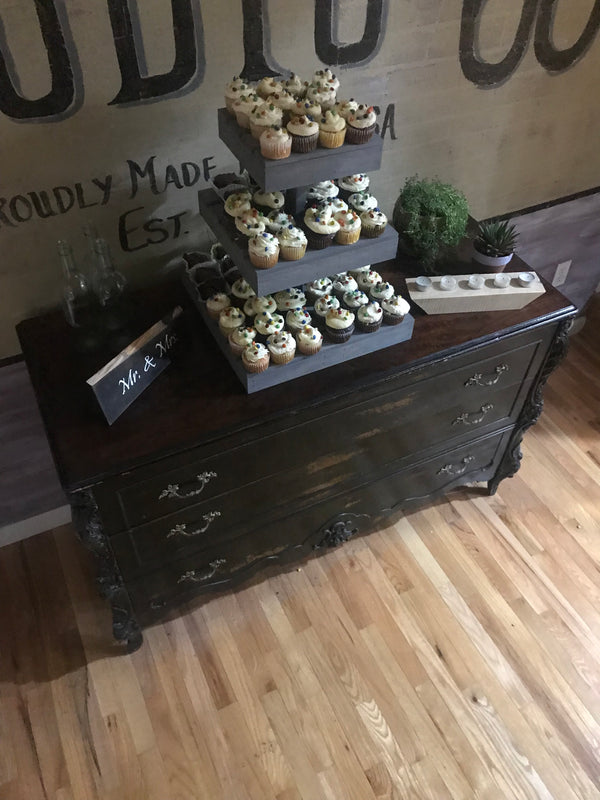 Full display of rustic antique gray 3-tier cupcake stand on a wedding dessert table.