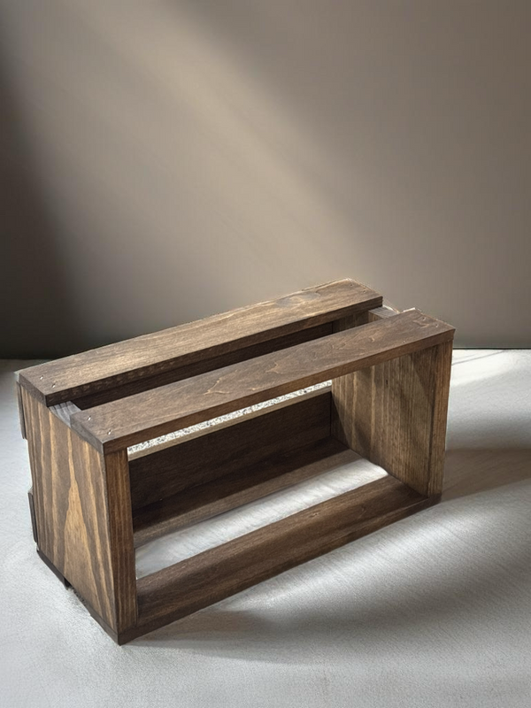 Rustic wooden CD holder crate empty on neutral background.