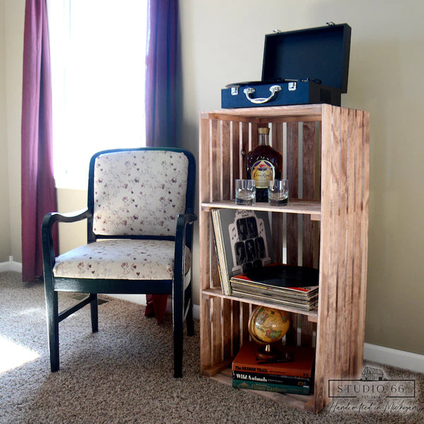Lifestyle view of cherry 3 tier turntable stand with vinyl records and rustic furniture