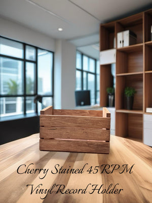 Wooden cherry stained 45 RPM record crate side view on desk