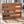 Cherry stained wooden record crate for LP vinyl organization