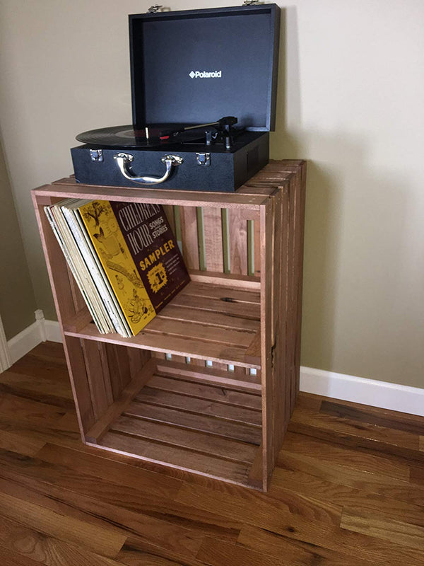 Rustic cherry stained 2-tier wooden turntable stand with vinyl records and record player.