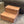 Rustic cherry wood pet steps two tiers high next to furniture