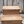 Front view of cherry stained two-step wooden pet stairs on deck