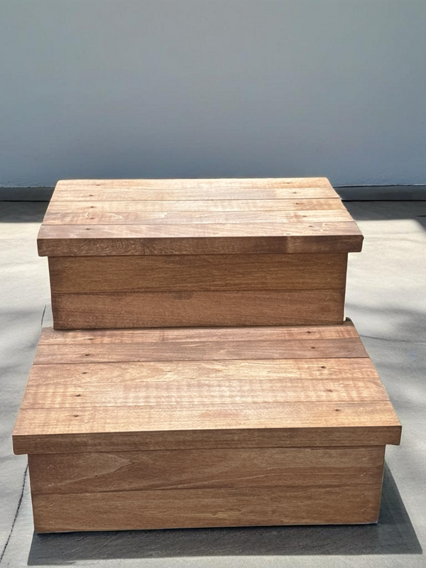 Cherry stained rustic two-step wooden pet stairs in sunlight