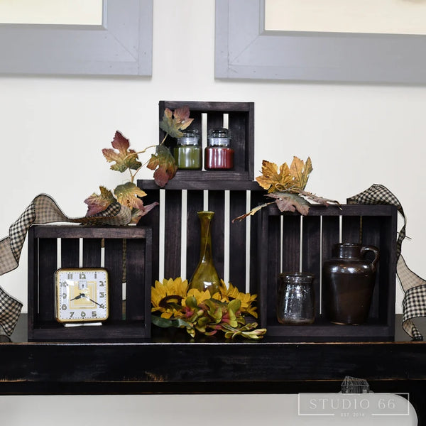 Rustic dark wood crates for stylish home storage and decorative display.