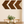 Dark walnut wooden chevron arrows hanging above dining room table, rustic wall art