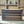 Empty rustic DVD holder wooden crate, angled front view.
