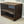 Rustic entryway shoe rack in dark walnut finish against wall with graffiti