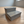 Gray rustic 2-step pet stairs displayed in a modern room with wooden flooring.