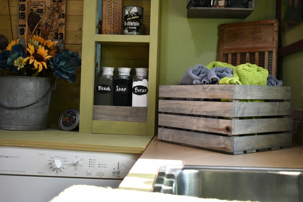 Rustic gray stained wood crate with slat ends for versatile use

