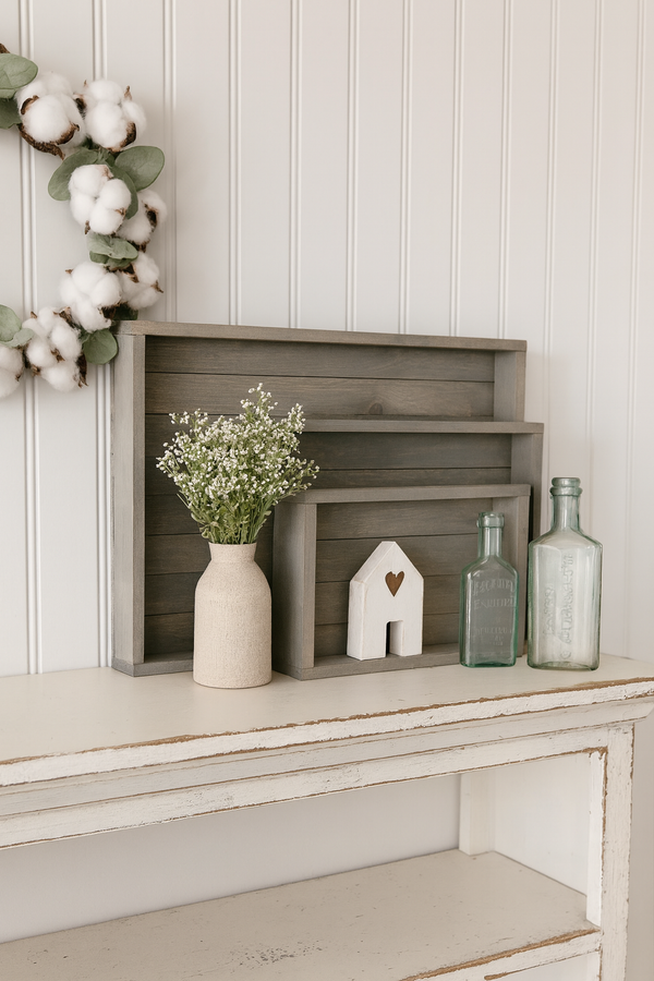 Rustic gray trays styled with cotton wreath and farmhouse decor.