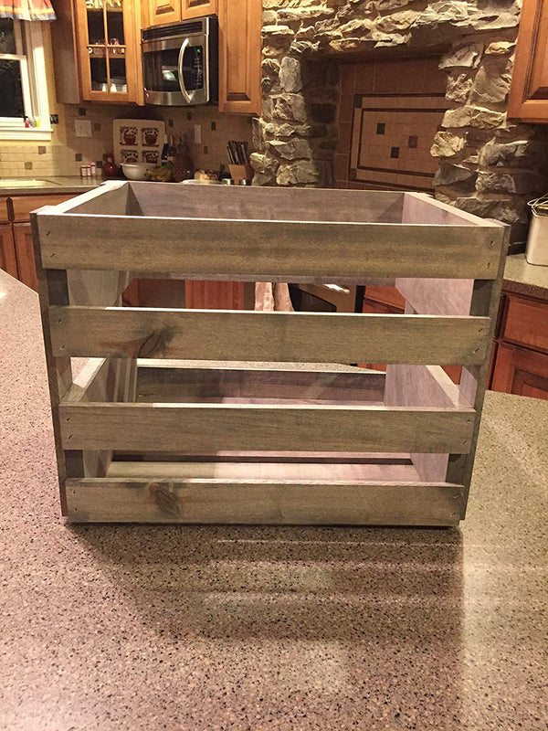 Empty gray stained wooden vinyl record storage crate displayed on a kitchen counter.