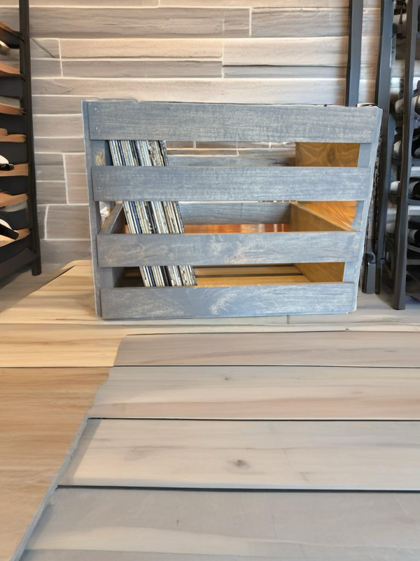 Large gray stained vinyl record storage crate shown with LPs inside.