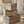 Farmhouse nesting crates stacked in rustic home setting with wood backdrop.