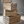 Wooden farmhouse nesting crates stacked decoratively on rustic wood floor.
