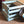 Vintage Blue wooden record crate holding vinyl LPs on carpet